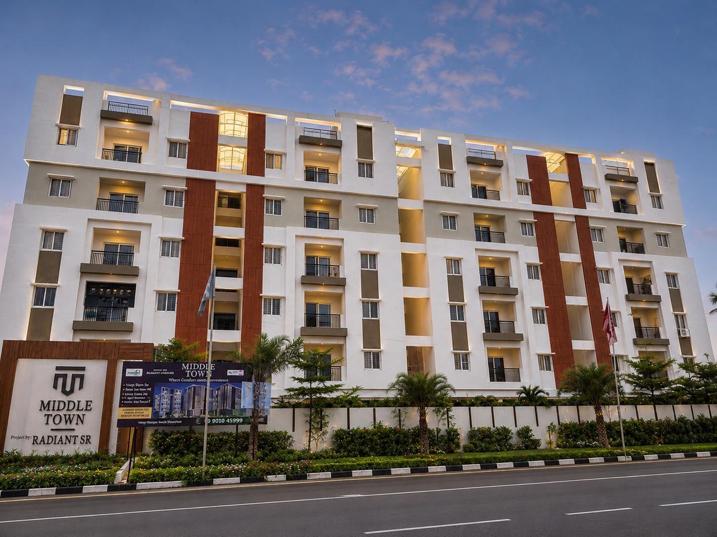 Middle Town apartment block facade at dusk, Kandlakoya, Medchal